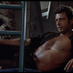 Jeff Goldblum's Dr. Ian Malcolm lounges with his black shirt open in a classic scene from Jurassic Park.